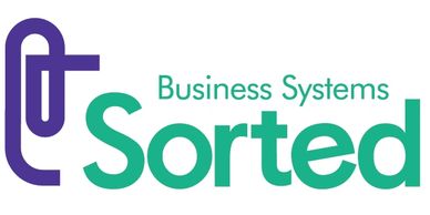 Purple stylised paperclip and words "Business Systems Sorted" in green.