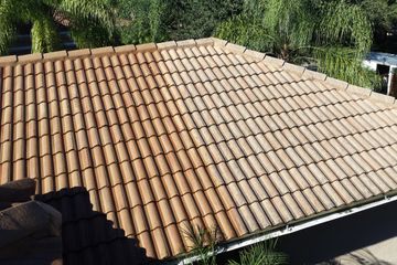 Tile Roof cleaning by Wizard pressure washing.