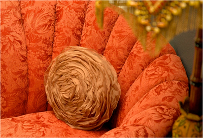 rose red Edwardian damask fan or shell shaped chair with brown victorian rose pillow and bamboo lamp