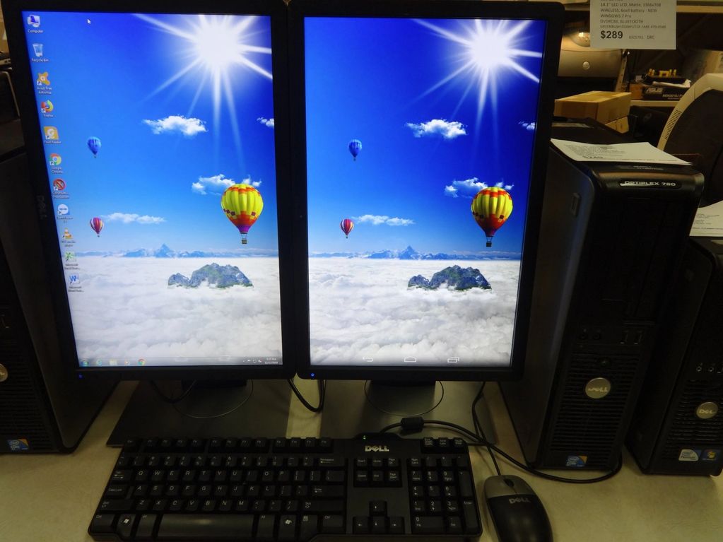 Dual widescreen LCDs in portrait mode.