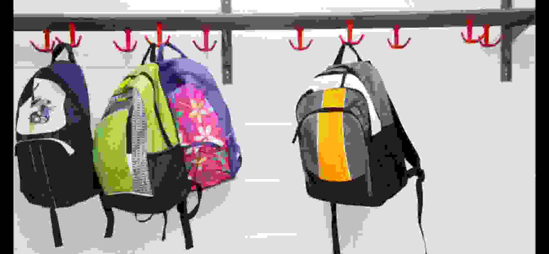 school backpacks hanging on hooks for school cleaning