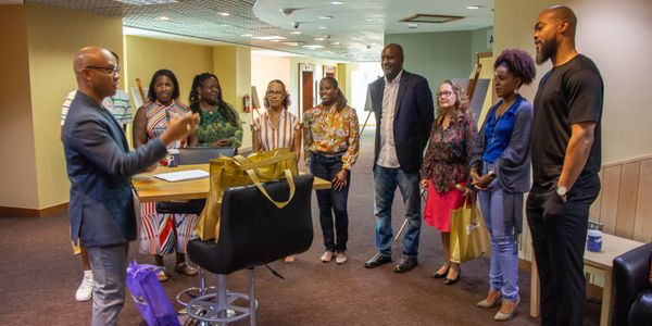 Dr. Ty coaching a team of leaders at an Animation Festival providing business strategy