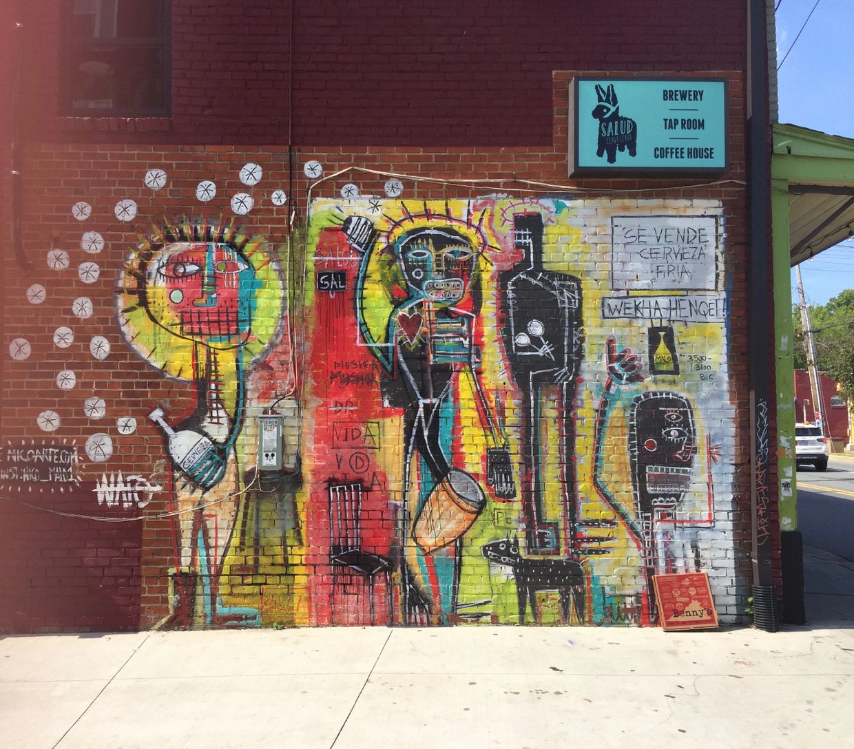 Various abstract and cubist-like figures play drums, drink beer and hang out with their friends