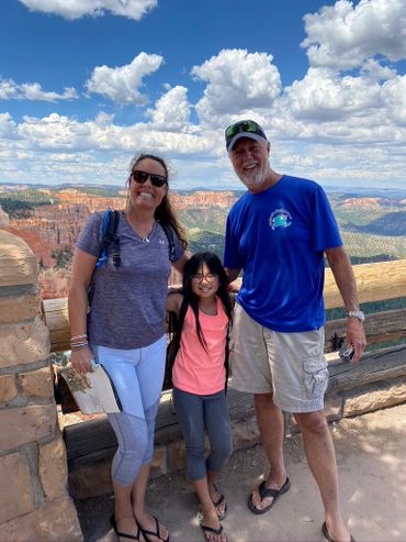Ali, Rich, & Chloe traveling at the Grand Canyon. They are local business owners of Siesta Bungalows