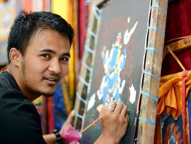 Bijay, the artist and proprietor painting oMahakala Thangka at Himalayan Arts Gallery, Thamel, Nepal