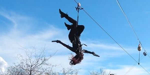 Ziplining upside down with two guns! Enjoying ziplining and shooting at Outlaw Zipline!
