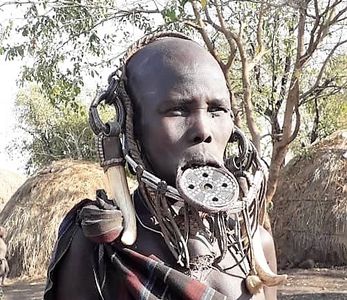 Mursi woman with lip plate in Mago National park Omo Valley Ethiopia