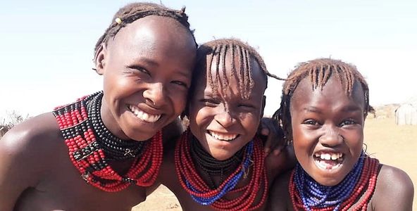 Dassanech girls joking around in Omo Valley Southern Ethiopia