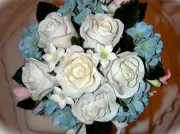 Handmade sugar roses, hydrangeas and stephanotis bouquet floral keepsake wedding cake topper.