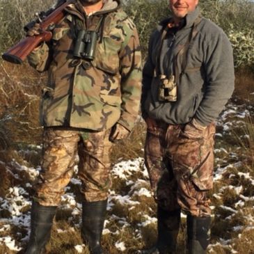 This is an image of two hunting guides on a hunting ranch in South Texas.