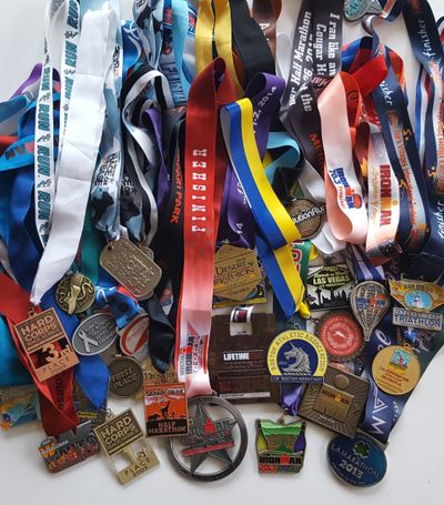 Boston marathon, triathlon, cycling, swimming, racing, winning, podium.