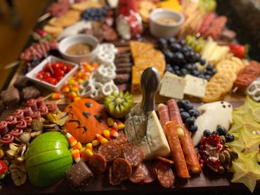Charcuterie Board with an assortment of meat and cheese highlighting a Halloween theme.