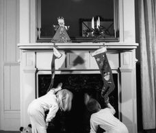 How does Santa slide down the chimney?