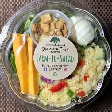 Packaged farm-to-table salad with cheese, egg, and croutons.