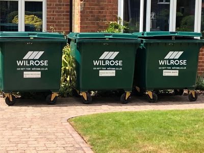 Business Waste 1100L general waste bins in Dorking at a school.