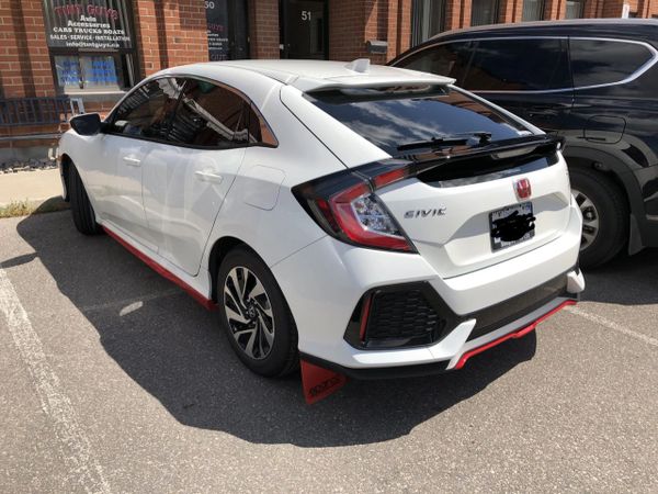 White Honda with tinted windows
