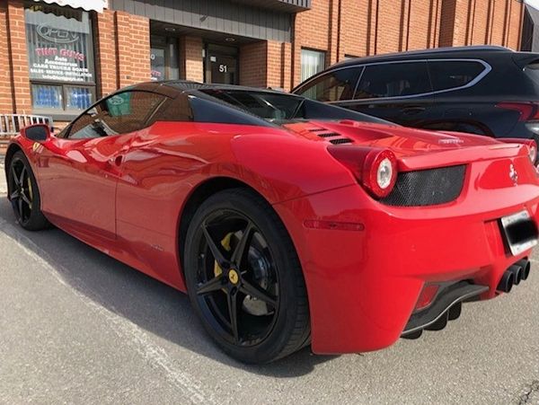 Red Ferrari with window tinting in Toronto
