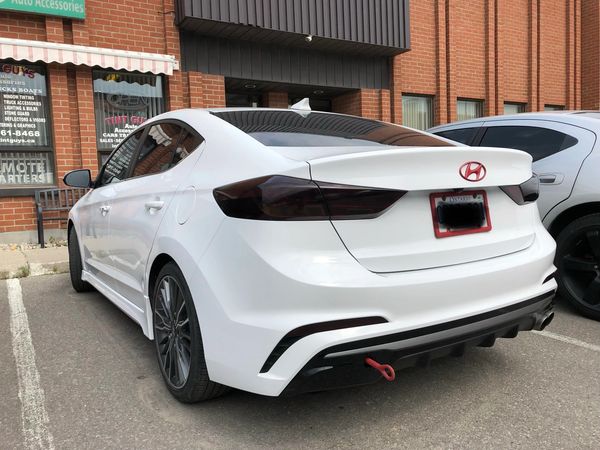 white car with window tint and taillight tint