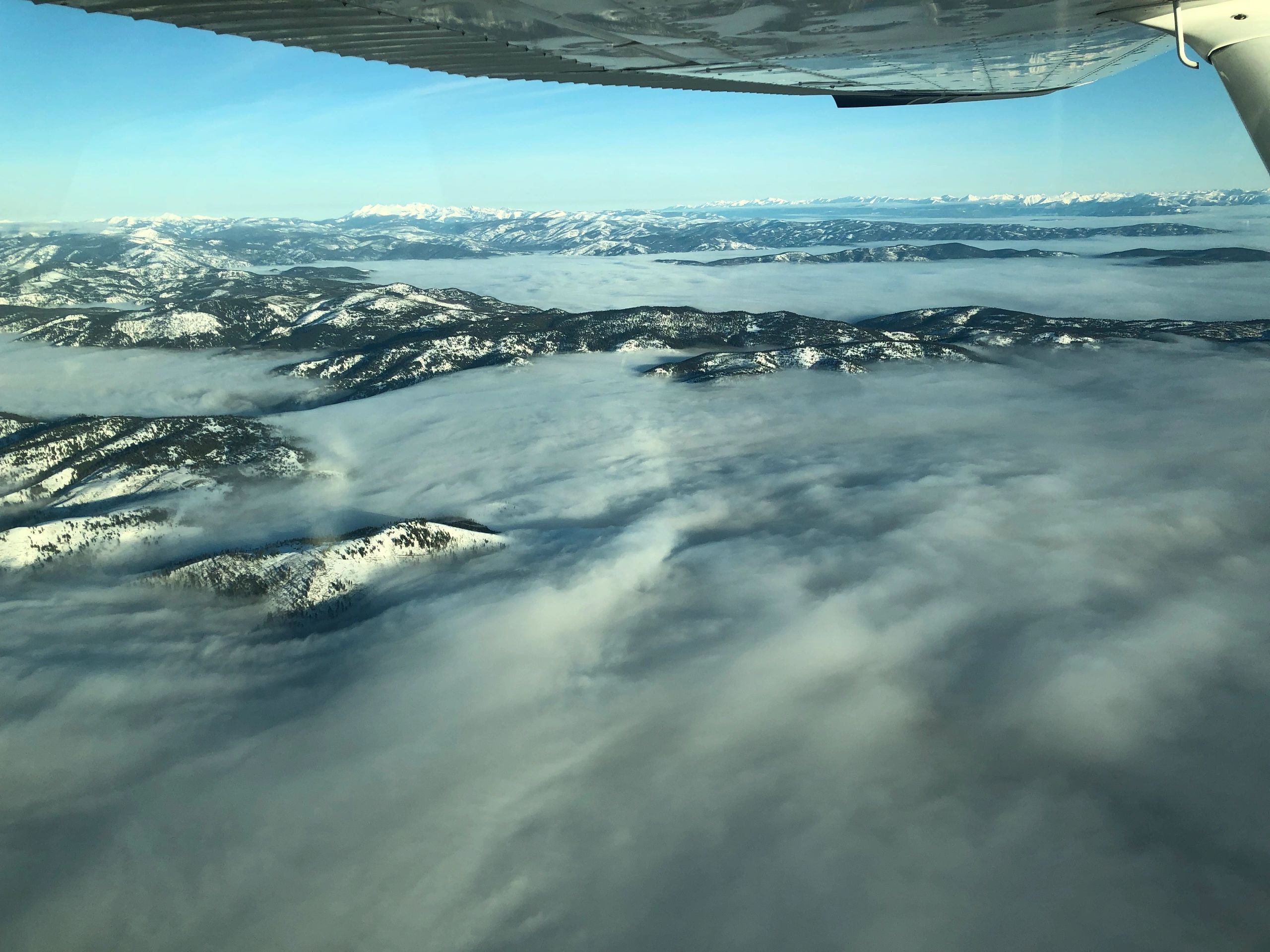 The view of the fog blanket from a Cessna 172 on a cross country flight.