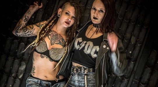 Two women in goth costumes