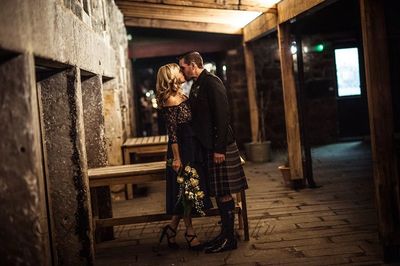 Husband and Wife posing for photos with Justine photography after the wedding.