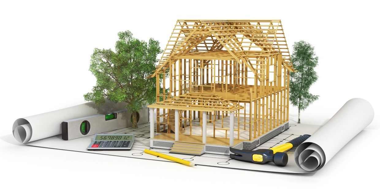 New home model mock-up displayed with blueprints, tools, & calculator - kaitechplumbing.ca