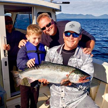 First time young angler catches a king salmon in Ketchikan Alaska