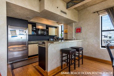 mamibeachoceanrental r5f living room kitchenette