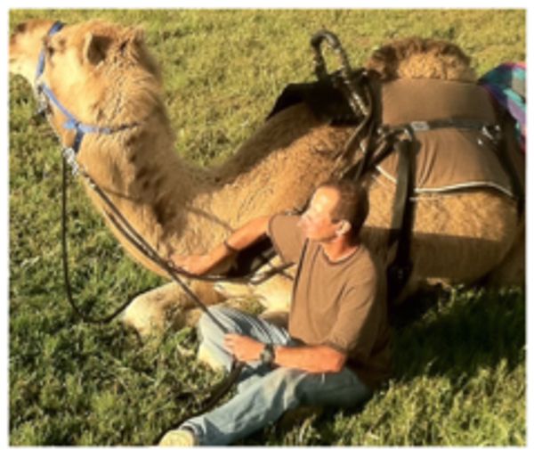 Gil and Camelot relaxing while out on a trail ride