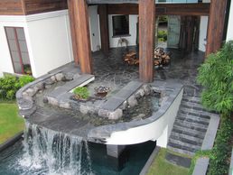 Pool waterfall water feature in Palm Beach Florida A Florida Waterfall company