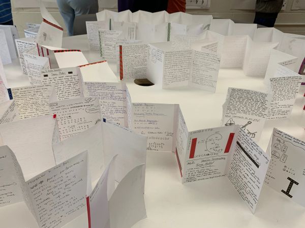 Handmade journals to document and track the creative process.