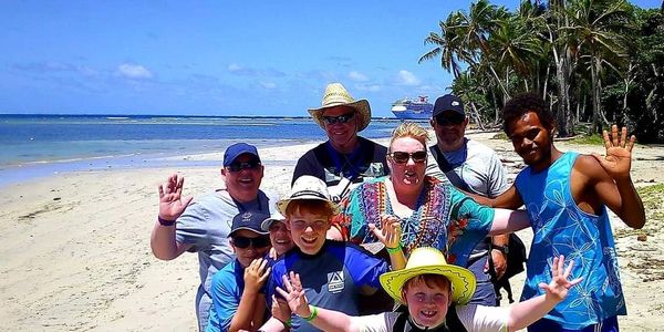Tourists on the Guided Village Walk Tour at Mystery Island.