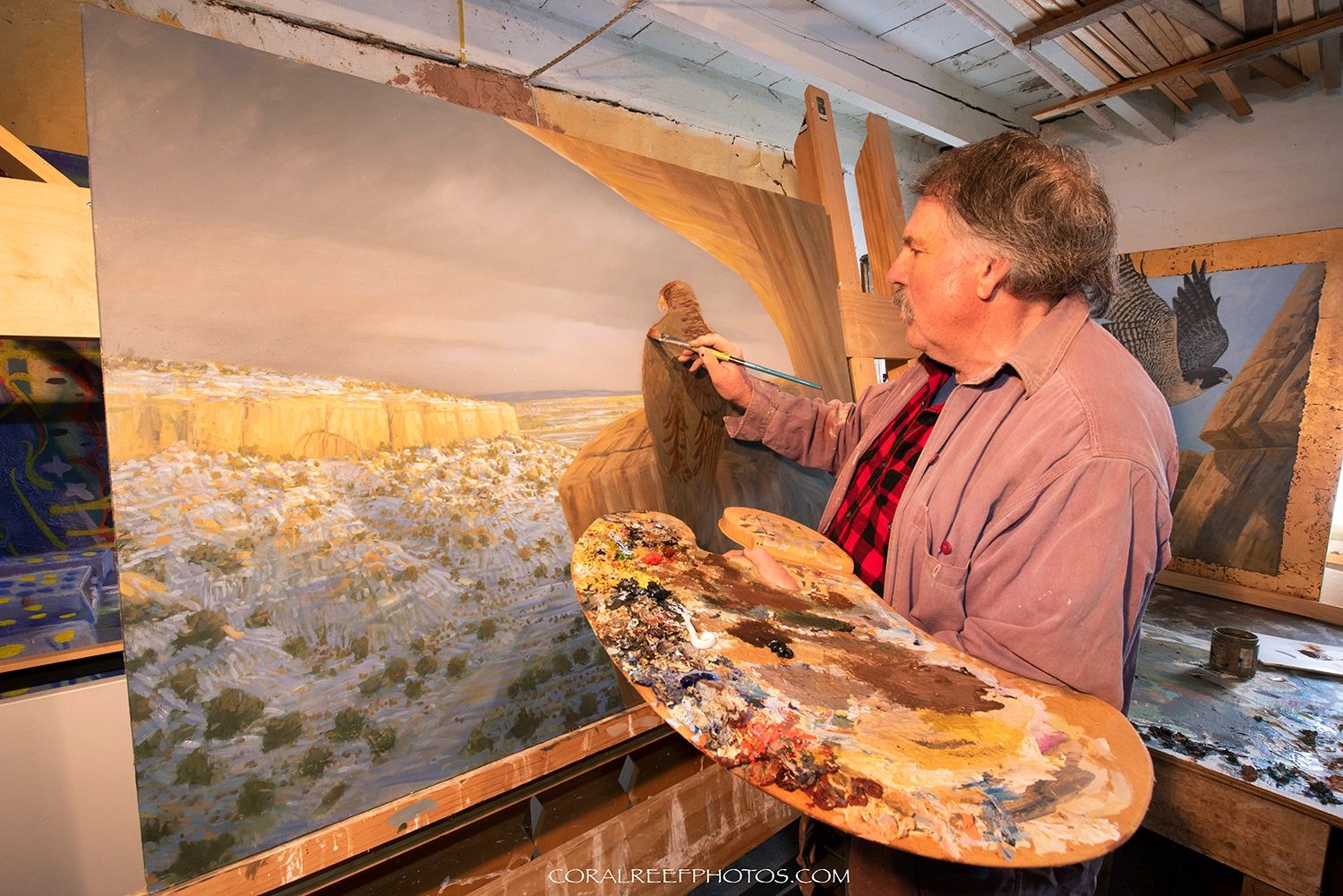 Roark painting in his studio in Rowe, New Mexico.