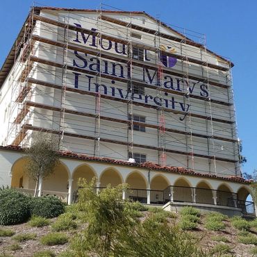 Exterior Sign Painting. Hand painted logo and lettering. Mount Saint Mary's University Wall Sign.