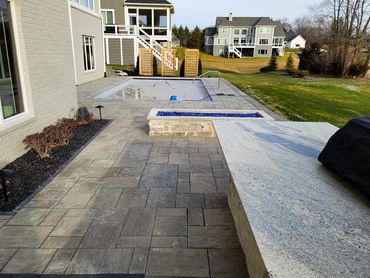 Pool Installation with Paver Patio, Fireplace, and Outdoor Kitchen