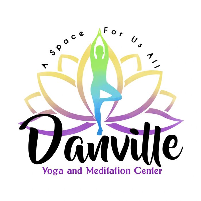 Yoga props including a purple belt, two gray blocks, and circular wooden tokens on a black speckled mat.