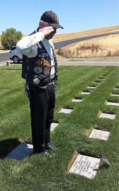 1st Vice Commander George Smith salutes a veteran.