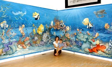 artist Gayle Mangan Kassal in art studio with Pediatric mural
