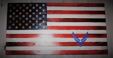 A rustic American Flag with hand carved stars with a U.S. Air Force logo