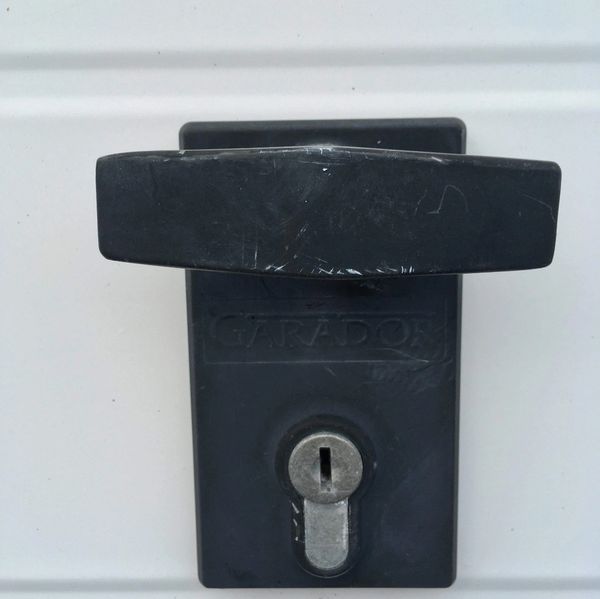 <img  src="garage door handle . jpg"  alt="garage door handle and lock">