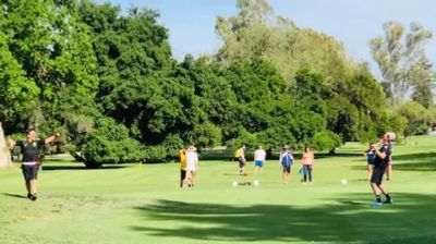 people playing footgolf on a golf course