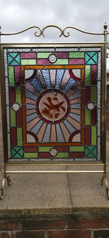 Stained glass fire screen made by leaded glass studios