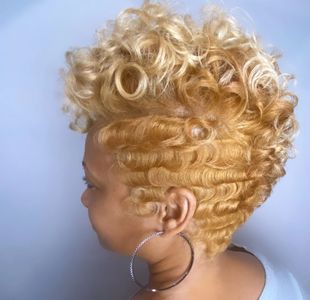 a woman with curly golden hair.