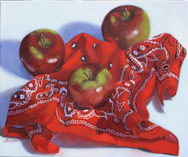 Red/green MacIntosh apples on a red bandana.