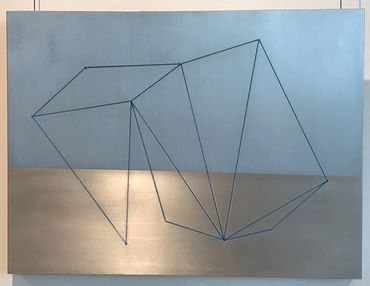 Abstract geometric line art on a blue and beige background.