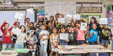 Ocean Ramsey and Juan Oliphant giving  speaking at schools in Hawaii about sharks 