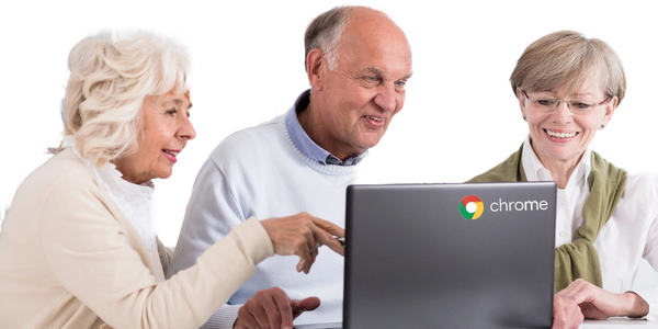 Seniors looking at a Chromebook