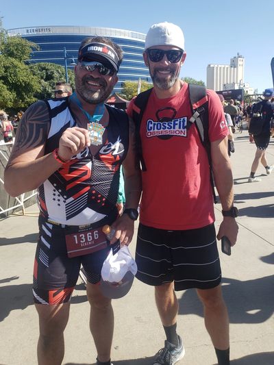 Coach Andy with Ironman 70.3 Arizona 2019 Finisher Geremie 