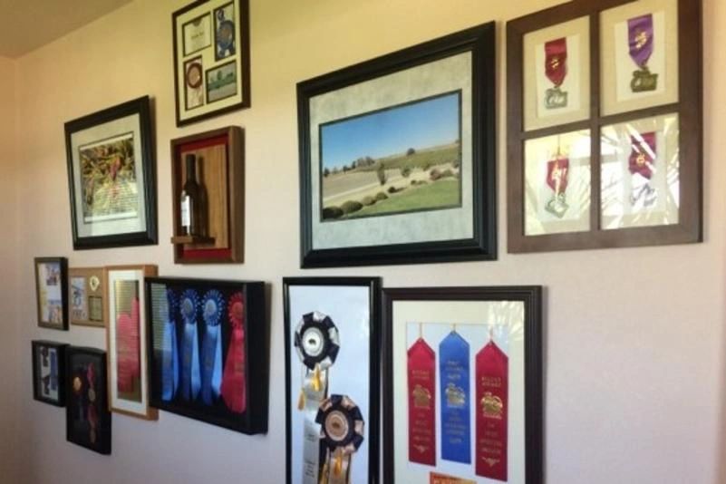 awards and paintings on the wall 