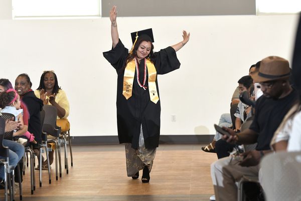 Graduates walk down the aisle in celebration of their accomplishments